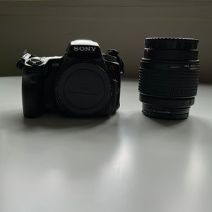 Sony-Lens is a 28-80mm. Includes camera, battery and charger, lens and filter.